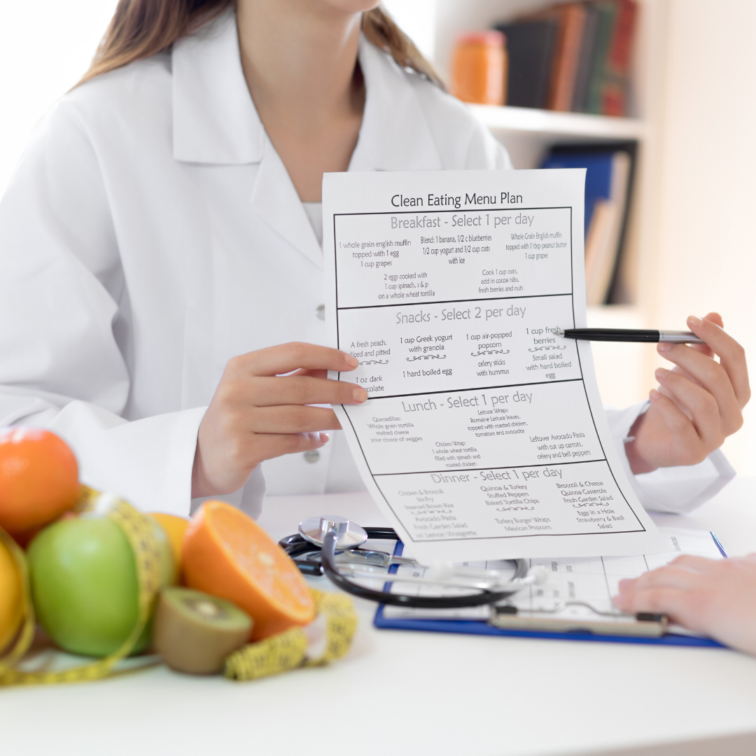 Nutritionist showing a nutrition plan, symbolizing guidance and planning in professional healthcare careers like massage therapy.