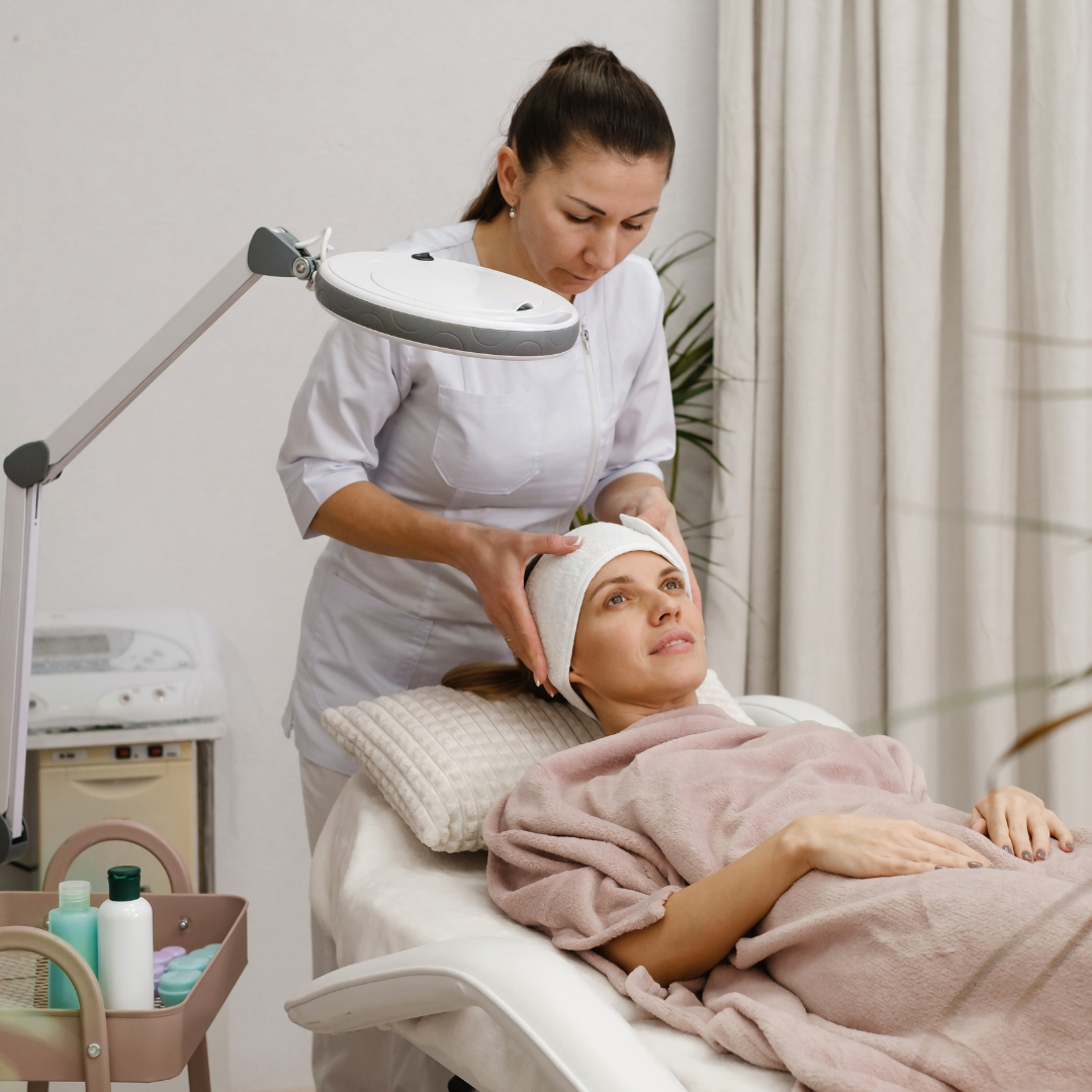 Happy woman preparing for a skincare treatment at a modern aesthetic clinic, before her procedure.